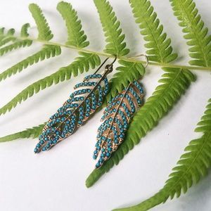 3/$10 Feather earrings